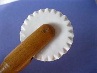 Antique kitchen dough cutter made of wood and porcelain ,circa1900