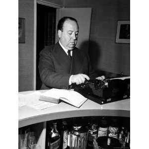 Movie Director Alfred Hitchcock Typing Script on a Portable Typewriter 
