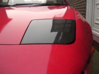 Carbon fibre headlight covers for your flip up OEM lights. Direct 