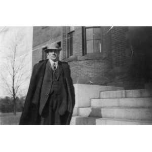 Robert Frost standing on the steps of the Pinkerton Academy, Derry, N 