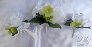 are made with one white rosebud accented with green hydrangeas