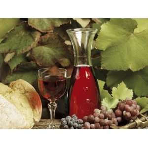 com Close Up of a Glass and a Jug of Red Wine with Bunches Red Grapes 